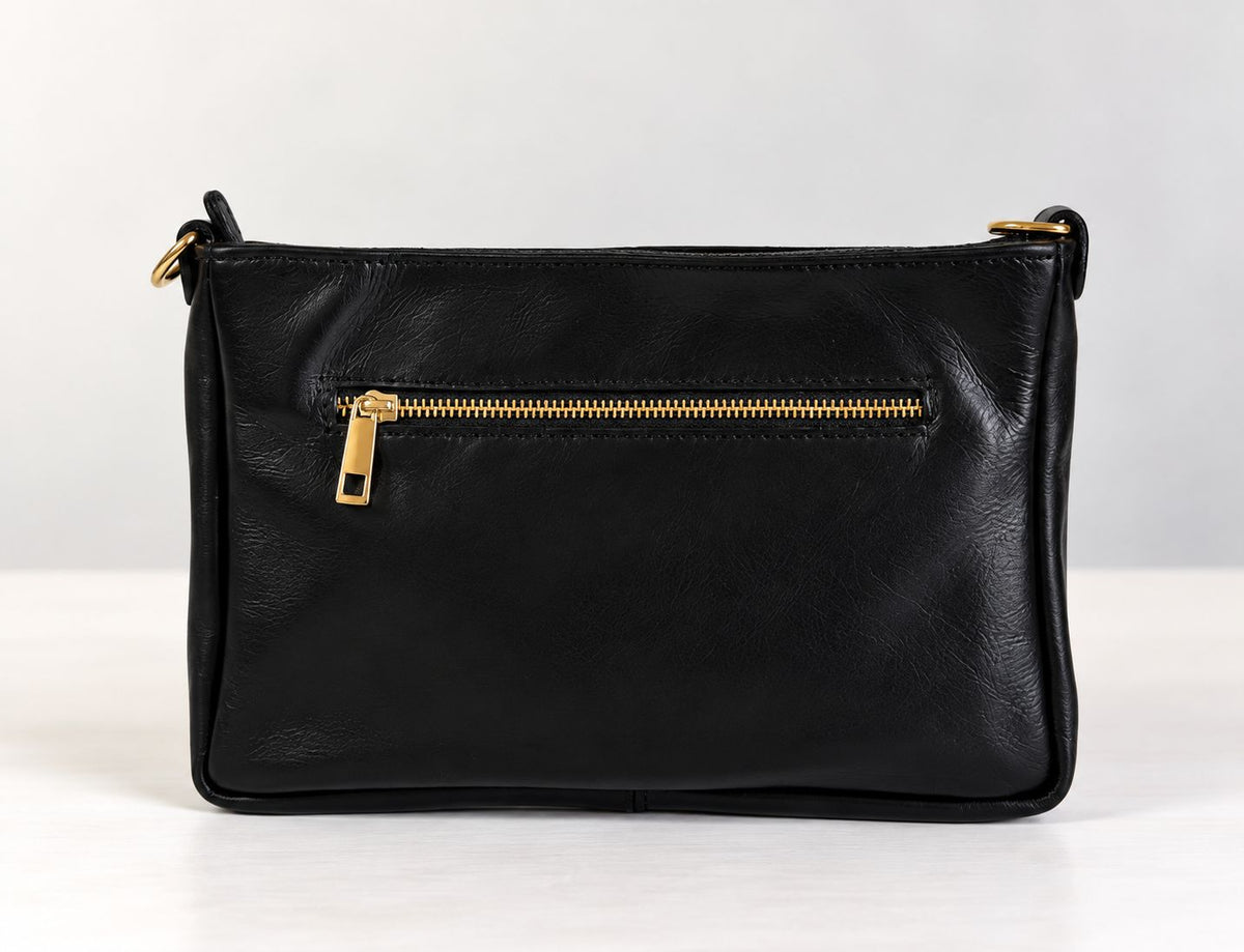 CLUTCH INTRECCIATA IN VERA PELLE