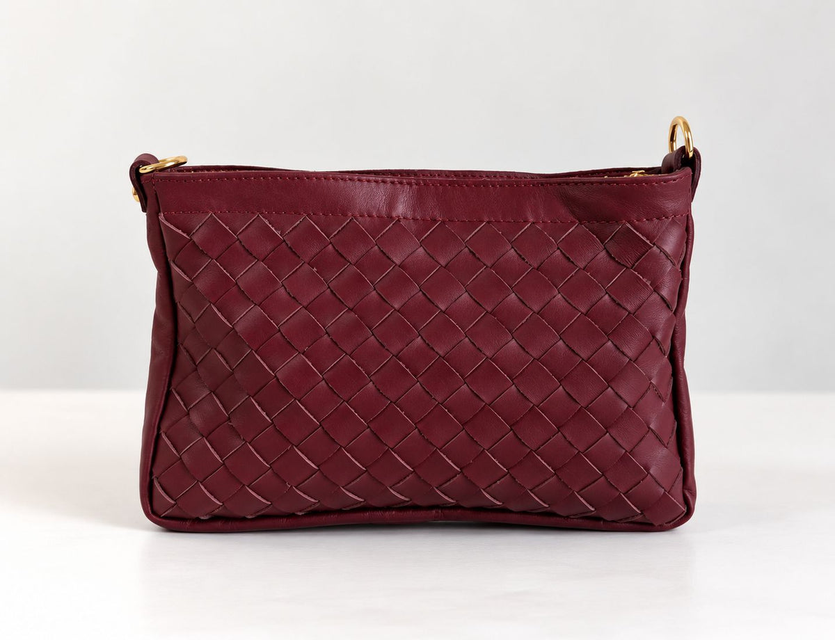 CLUTCH INTRECCIATA IN VERA PELLE