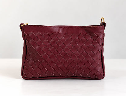 CLUTCH INTRECCIATA IN VERA PELLE