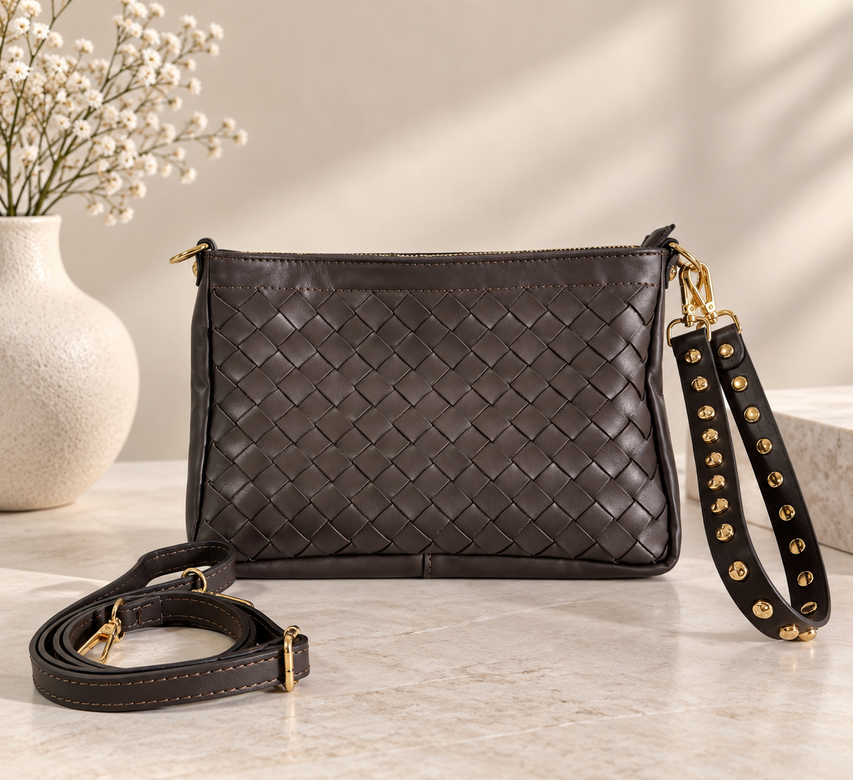 CLUTCH INTRECCIATA IN VERA PELLE